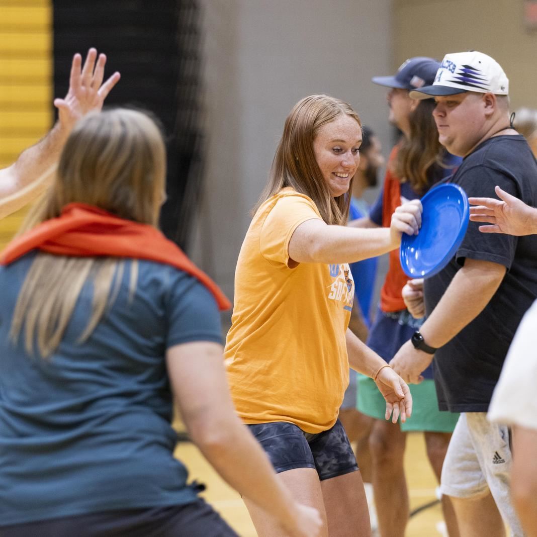  Gym teachers practice a game during a workshop